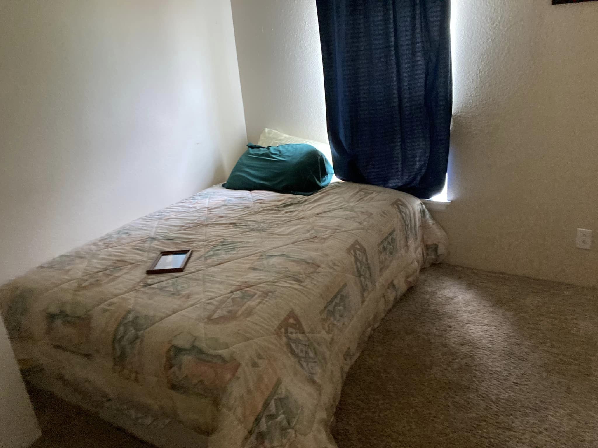 Interior space filled with discarded items before cleanout