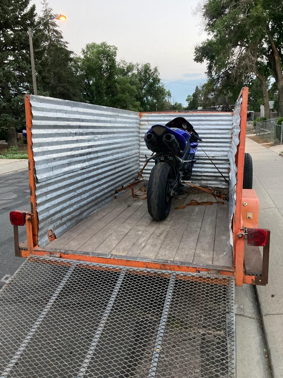 Motorcycle strapped for transport