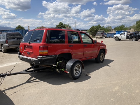 Truck towing heavy equipment